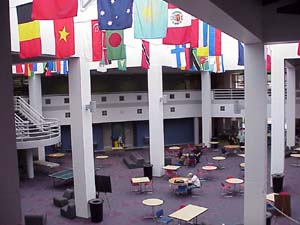 The Tomball Campus Commons, where numerous flags from various countries are hanging.