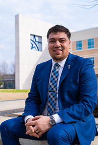 Photo of Raul Munoz in front of the CASA building