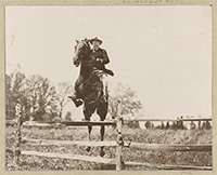Photo of Teddy Roosevelt jumping a horse over a fence