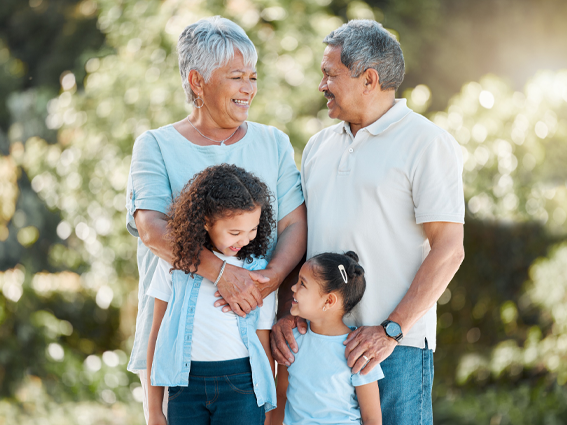 happy retired couple with grand kids