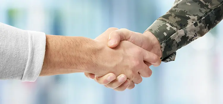 Civilian shaking hands with a veteran