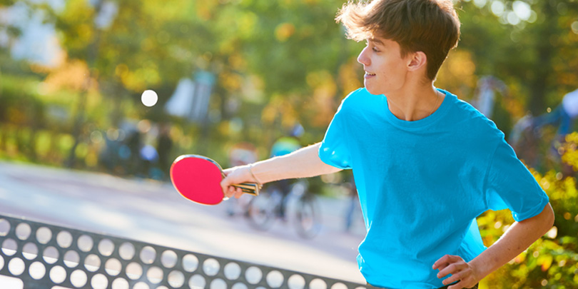 Person playing table tennis