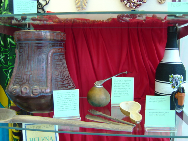 objects found in traditional kitchens, including a tea-infuser spoon/straw balanced above its cup