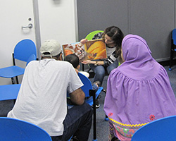 Ana Rodriguez reading to children