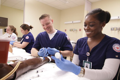 nursing students with simulation IV arm