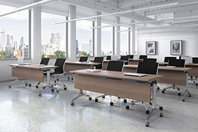 photo of a classroom with shared tables and chairs