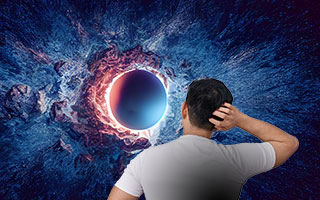 Thoughtful man facing the event horizon of a black hole in space
