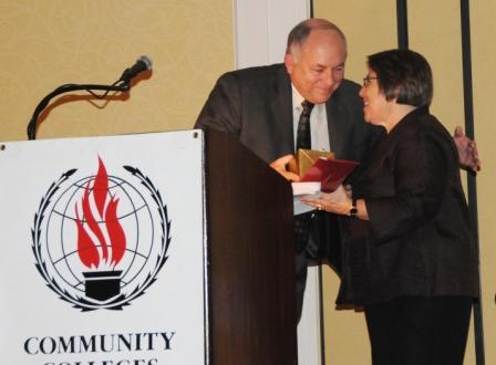 Dr. Richard Carpenter, Lone Star College System chancellor, left, provided introductory remarks for Dr. Martha Kanter, undersecretary of the U.S. Department of Education, right, and presented her with a gift at the CCID conference held Feb. 20 in The Woodlands. Kanter gave the keynote address at the conference which was sponsored by LSCS.