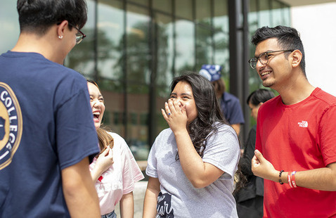 Students laughing on college campus