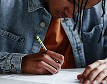 Student writing an essay