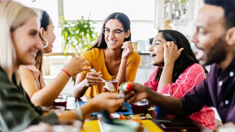 Students eating around a table