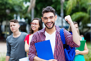 Student happily pumping fist
