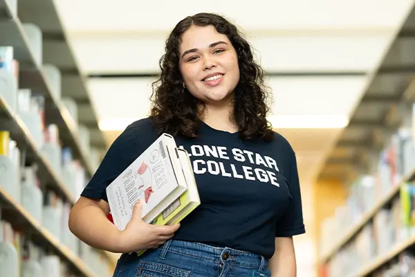 LSC student holding books