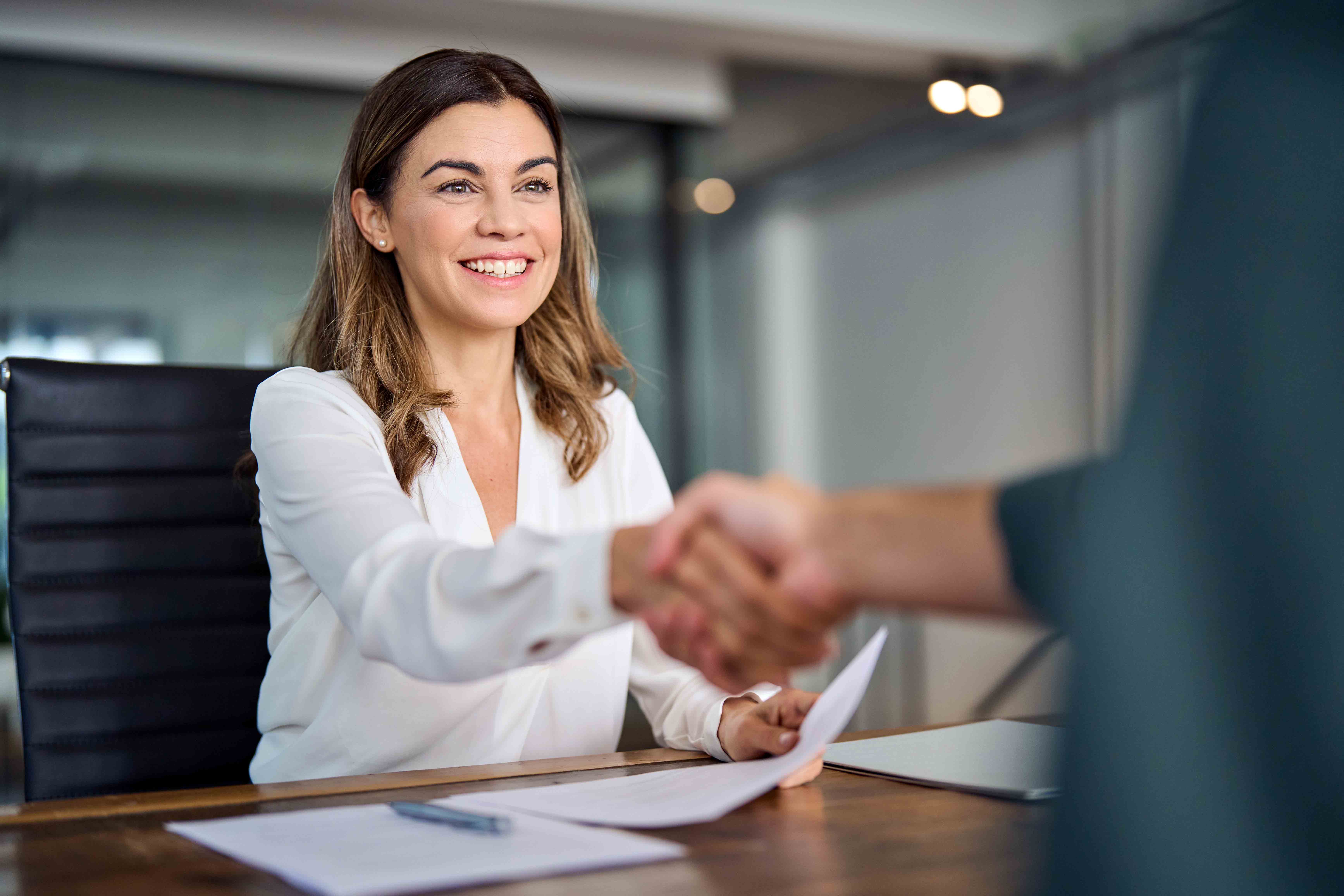 Woman shaking hands with another person