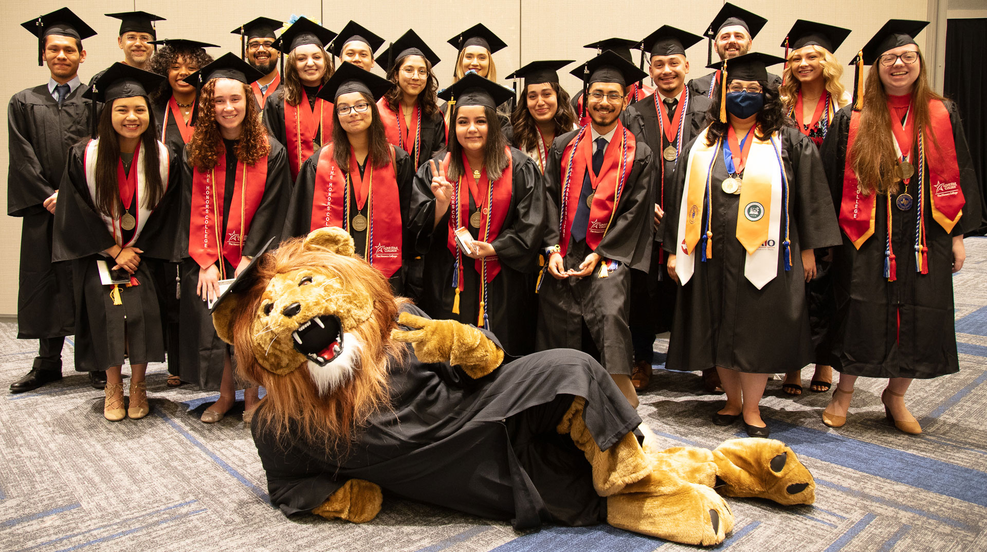 May 2022 Commencement Photo of Graduates with Leo the Mascot
