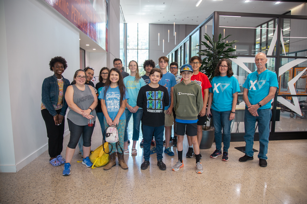 Group photo of students in camp with supervising adults