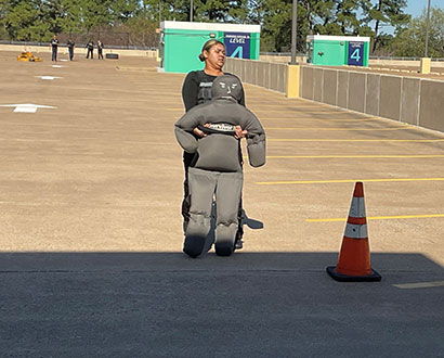 A student's technique, strength, and determination are put to the test as they drag a dummy in a fire challenge during the TXPSTA High School First Responders State Competition at Lone Star College-University Park, Feb. 24, 2024.