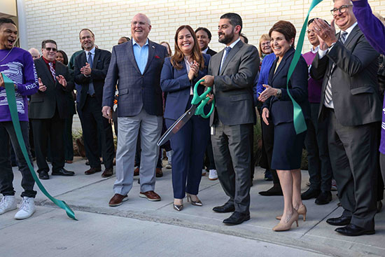 Lone Star College Chancellor Mario K. Castillo (center) cuts the ceremonial ribbon at the grand opening of LSC-University Park's Visual and Performing Arts Center. 