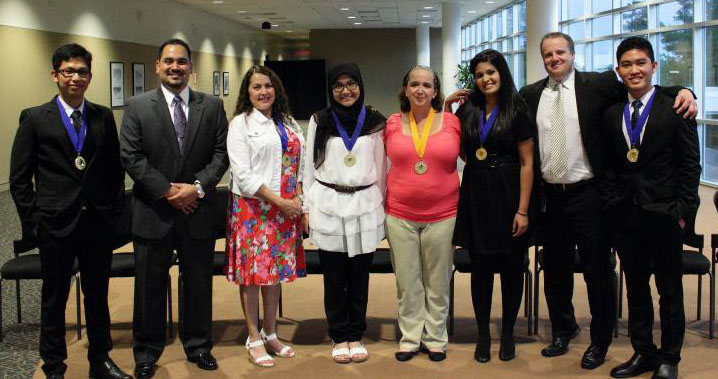 Shawna Beaudreau, pictured right of center, with fellow Phi Theta Kappa inductees and advisors.