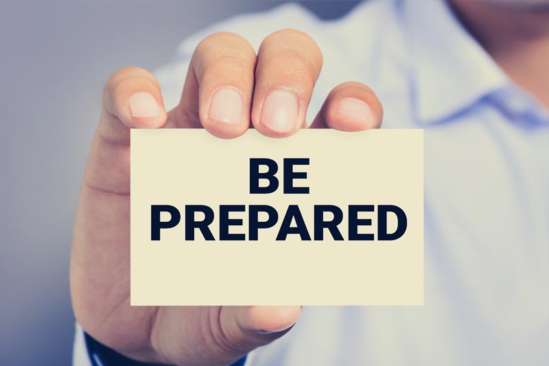 Photo of a man holding a plaque saying be prepared