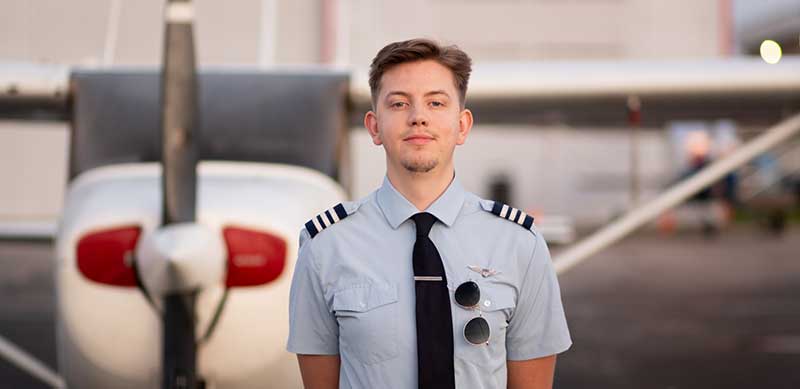 Man standing in front of plane 