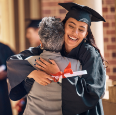 Happy Graduate and Family Member Hugging