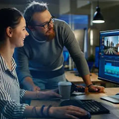 Two people at a computer