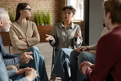 adults sitting in a group session