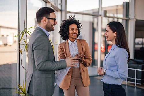 Happy people standing talking