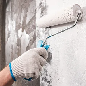 Paint roller on a wall