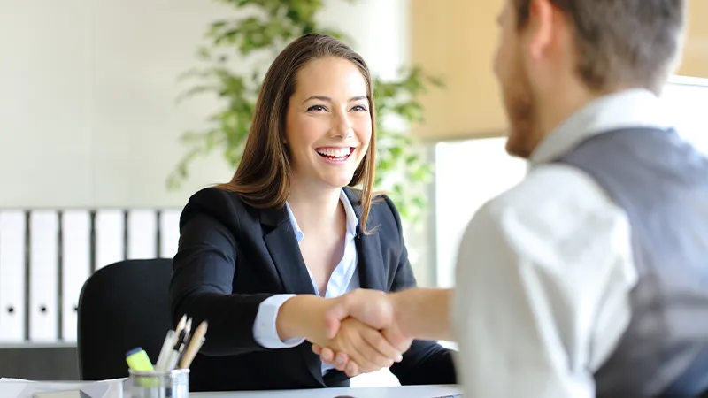 Businesspeople handshaking after nterview