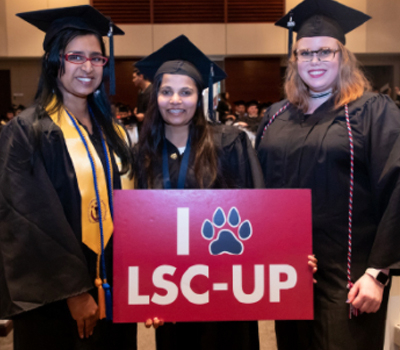 University Park graduates holding sign. I paw l s c u p