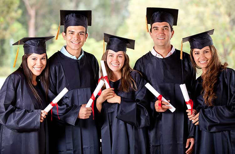 group of happy Hispanic students graduating 