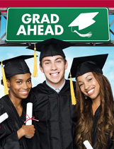 Graduates in regalia with GRAD AHEAD road sign