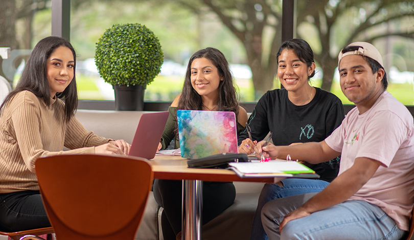 college students at a table studying