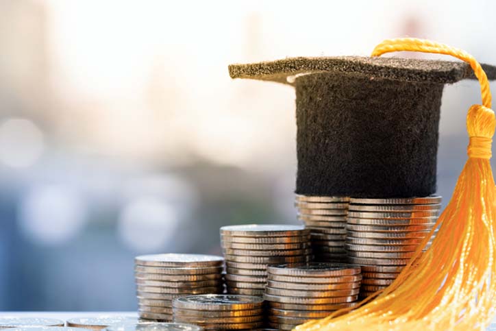 coins with a mini graduation cap on top