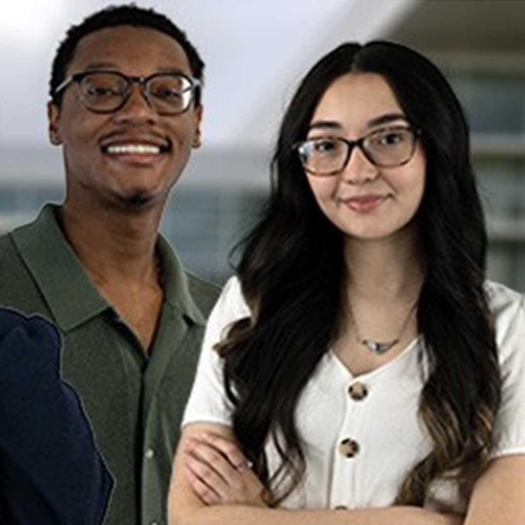 Two students posing in front of the CASA building.