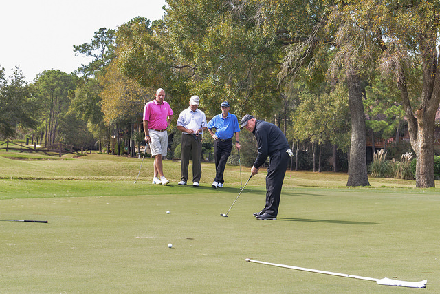 Chancellor Steve Head attempts a put at the Tournament Course