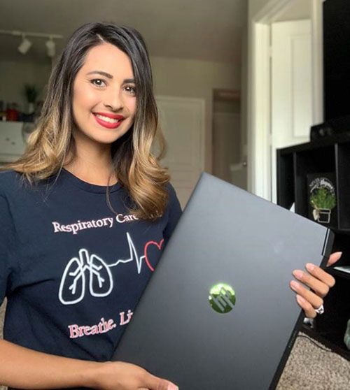 LSC-Kingwood student Krysten Garza with her new laptop.