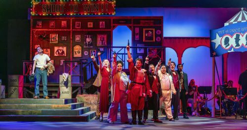 Group of actors on stage performing 