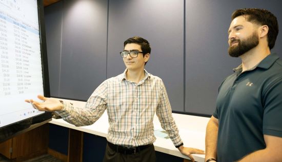 Student and staff member talking 