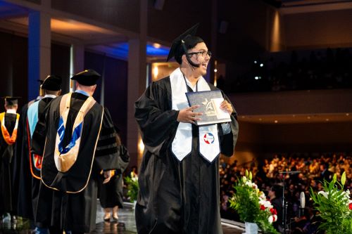 Graduate walking across stage