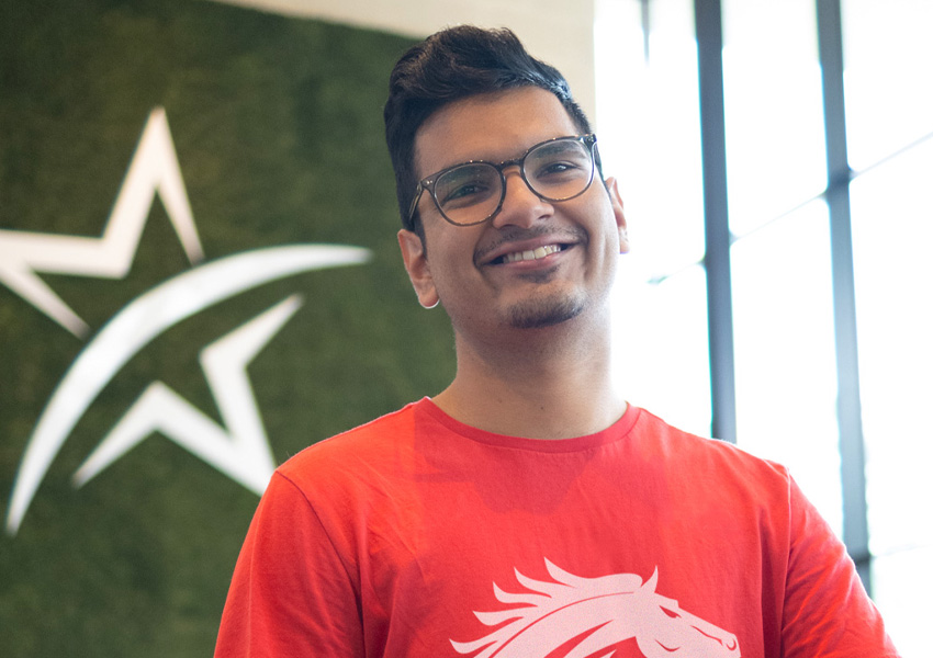 student smiling in maverick student center registering for classes