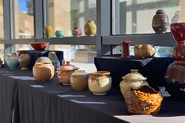 photo of ceramic pots and vases of various colors