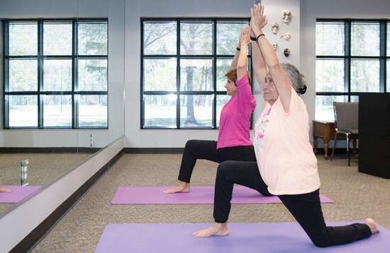 ALL Members enjoy a yoga class