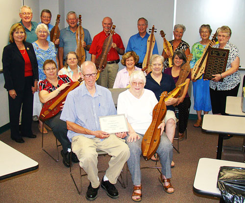 Holding her dulcimer, Nancy Price (pictured front right), Lone Star College-Montgomery’s Academy for Lifelong Learning’s Instructor of the Year, is surrounded by current and former dulcimer students.