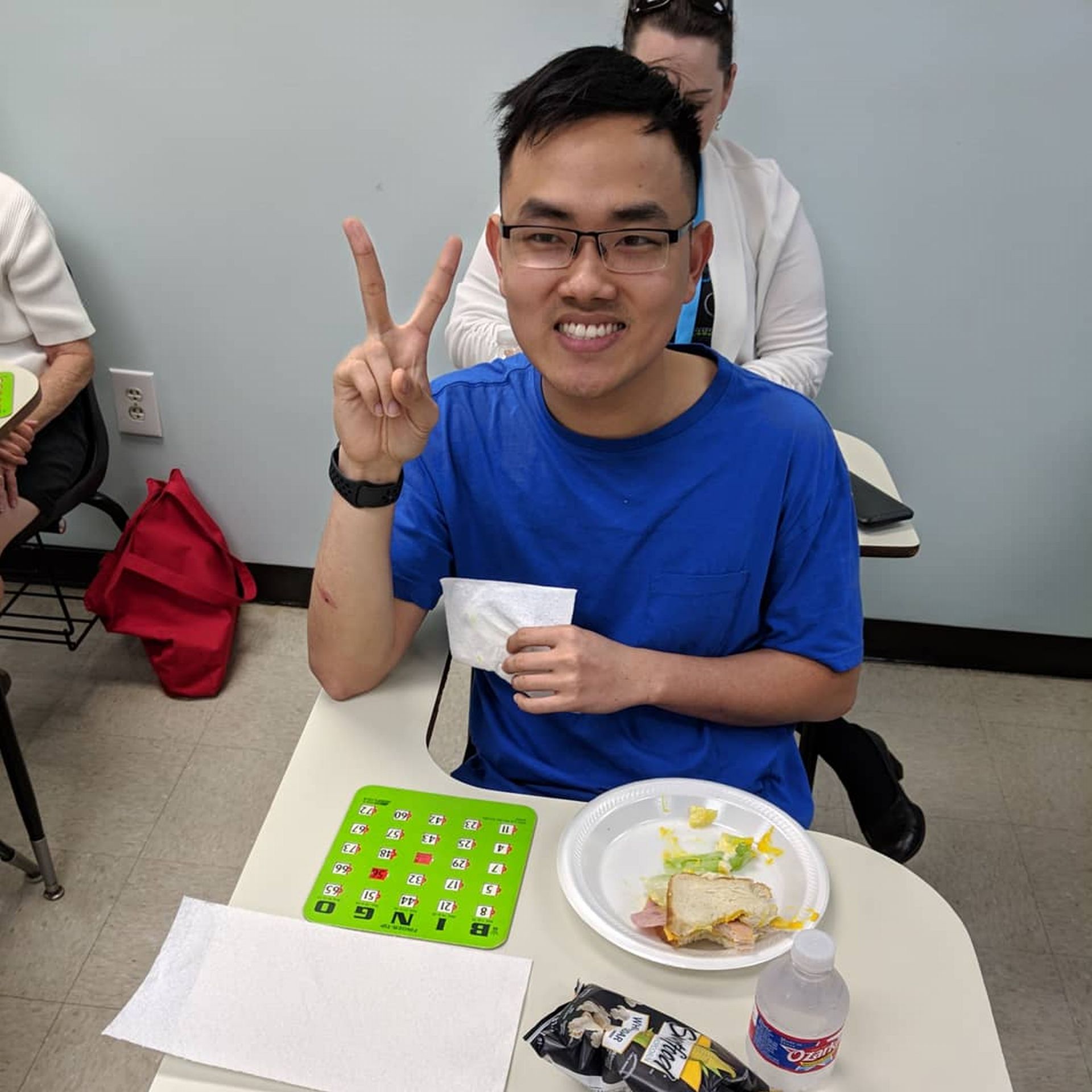 Photo of student playing bingo and eating