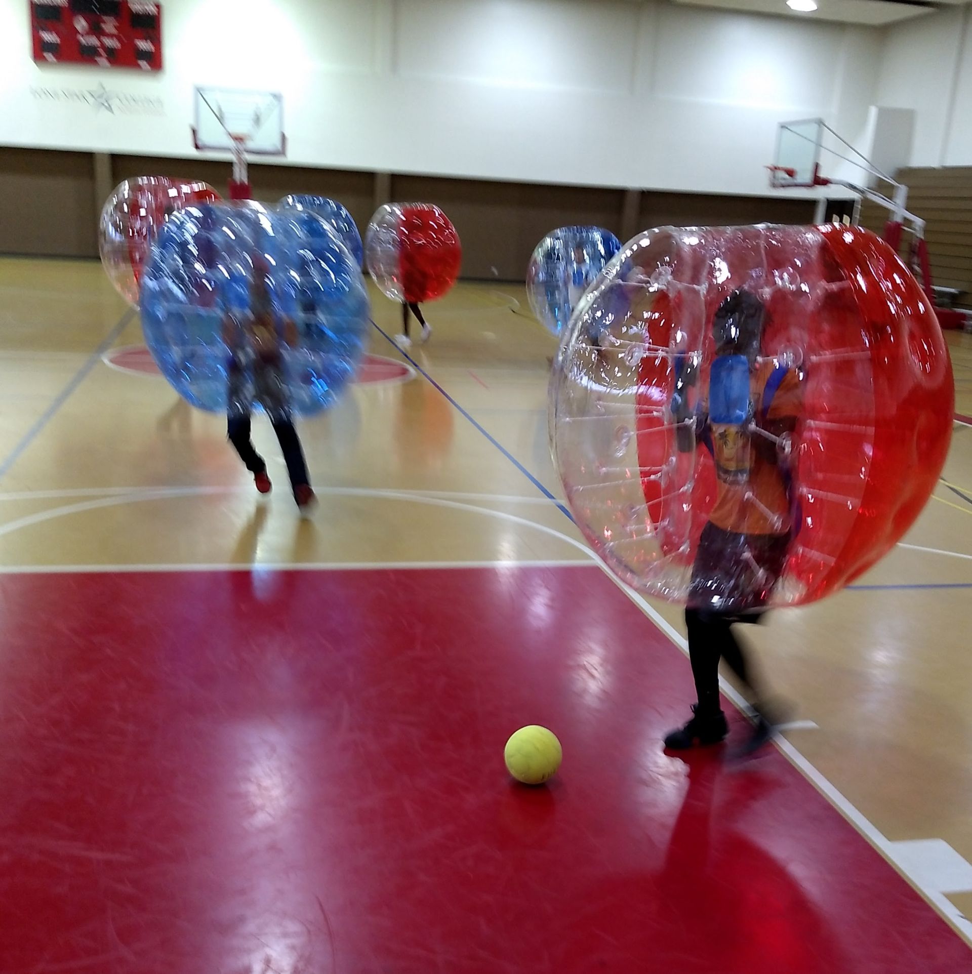 Photo of students playing bubble soccer