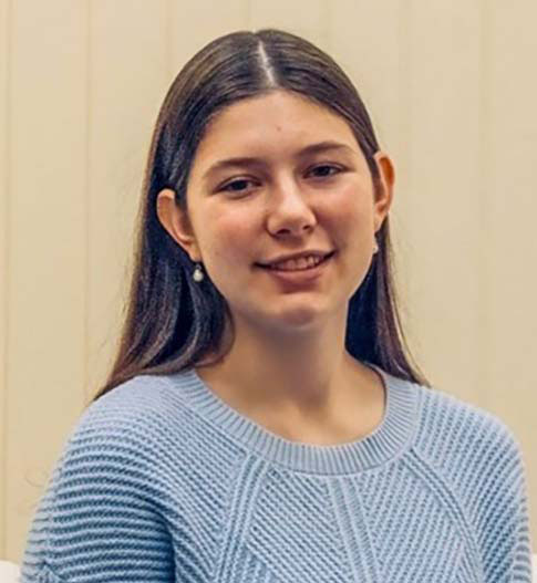 Photo of female student wearing a blue sweater