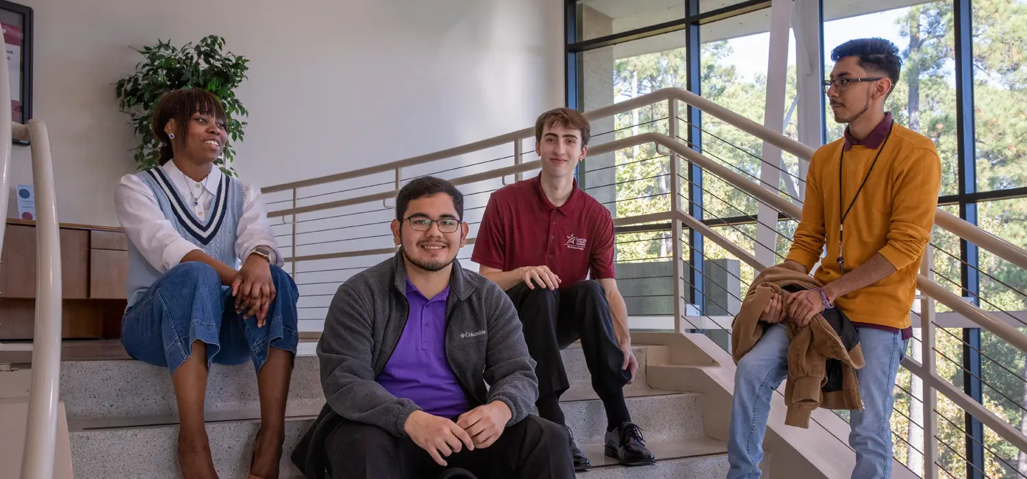 Students standing on a staircase